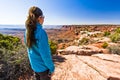 Woman Hiking in Canyonland's Desert Terrain