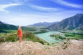 Woman hiking in coral clothes outdoors. Travel Lifestyle concept adventure vacations Royalty Free Stock Photo