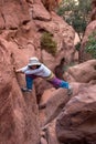 Woman hiking in a dry canyon Royalty Free Stock Photo