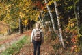 Woman hiking on footpath in autumn f Royalty Free Stock Photo