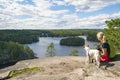 Woman hiking in forest in National Park with dog