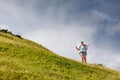 Woman hiking in mountains with big backpack Royalty Free Stock Photo