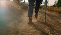 Woman hiking in mountains at summer vacation. Female hiker walking on dirt road Royalty Free Stock Photo