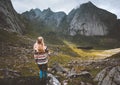 Woman hiking in mountains travel solo in Norway outdoor adventure Royalty Free Stock Photo