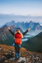 Woman hiking in Norway active travel lifestyle girl traveler success raised hands on mountain top in Lofoten islands Royalty Free Stock Photo