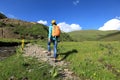 woman hiking in prairie mountains