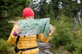 Woman hiking and reading map Royalty Free Stock Photo