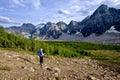 Woman hiking in rocky mountains. Royalty Free Stock Photo