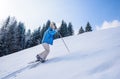Woman is hiking with snowshoes on snow trail in winter landscape of forest in Oberstdorf, Bavaria Alps in South of Germany. Royalty Free Stock Photo
