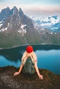 Woman hiking solo traveling in Norway female tourist with backpack enjoying view in mountains outdoor healthy lifestyle Royalty Free Stock Photo