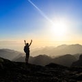 Woman hiking success silhouette in mountains sunset Royalty Free Stock Photo