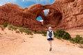 Woman Hiking to Double Arch in Utah National Park Royalty Free Stock Photo