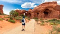 Woman Hiking to Double Arch in Utah National Park Royalty Free Stock Photo