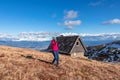 Woman on hiking trail from mountain hut Wolfsbergerhuette (Wolfsberger Huette) on Saualpe, Lavanttal Alps, Carinthia