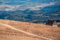 Woman on hiking trail from mountain hut Wolfsbergerhuette (Wolfsberger Huette) on Saualpe, Lavanttal Alps, Carinthia