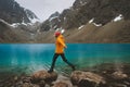 Woman hiking travel in Norway mountains with blue lake view