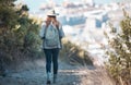 Woman hiking, travel and trekking in nature park, adventure and fitness outdoor with backpack and exercise. Female hiker Royalty Free Stock Photo