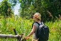 Woman hiking in tropical field