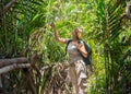 Woman hiking in tropical forest