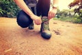 Woman hiking tying shoelace