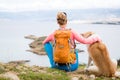 Woman hiking walking with dog on sea landscape Royalty Free Stock Photo