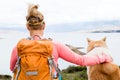 Woman hiking walking with dog on sea landscape Royalty Free Stock Photo