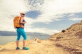 Woman hiking walking with dog on sea landscape Royalty Free Stock Photo