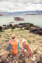 Woman hiking walking with dog on seaside trail Royalty Free Stock Photo