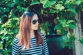 Woman Hipster with sunglasses Fashion Style Lifestyle Concept, wearing a black and white striped t-shirt. Royalty Free Stock Photo