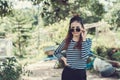 Woman Hipster with sunglasses Fashion Style Lifestyle Concept, wearing a black and white striped t-shirt. Royalty Free Stock Photo