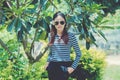 Woman Hipster with sunglasses Fashion Style Lifestyle Concept, wearing a black and white striped t-shirt. Royalty Free Stock Photo