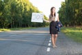 Woman hitchhikes for job Royalty Free Stock Photo