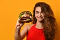 Woman hold big burger sandwich in hand hungry mouth getting ready to eat Royalty Free Stock Photo