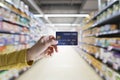 A woman hold a credit card with the supermarket background, Easy to payment shoping online new modern lifestyle Royalty Free Stock Photo