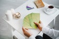 Woman hold metaphorical associative cards.