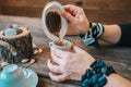 Woman hold the mug and telling fortune with traditional turkish coffee cup. Royalty Free Stock Photo