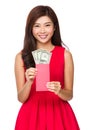 Woman hold red pocket with USD Royalty Free Stock Photo