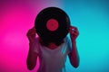 Woman Hold Retro Vinyl Disc With Neon Light