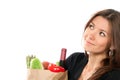 Woman hold shopping paper bag with vegetables