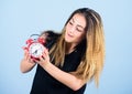 Woman hold vintage alarm clock. Practice of advancing clocks. Daylight saving time. Change time zone. Watch repair. Time