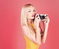 Woman hold vintage camera. Girl with retro photocamera