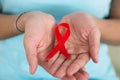 Woman Holding Aids Awareness Ribbon