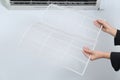 Woman holding air conditioner filters indoors, closeup Royalty Free Stock Photo