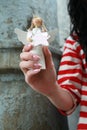 Woman holding an angel Royalty Free Stock Photo