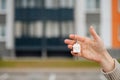 Woman holding apartment keys in front of house Royalty Free Stock Photo