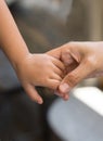 Woman holding baby in hand Royalty Free Stock Photo