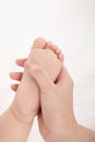 Woman holding baby& x27;s foot Royalty Free Stock Photo