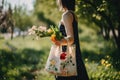 A woman holding a bag with flowers in it. AI generative image. Royalty Free Stock Photo