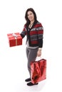 Woman holding a bag and a gift Royalty Free Stock Photo