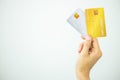 Woman holding bank business credit card on white background, Female hand holding bank credit card gold, Paying using credit card, Royalty Free Stock Photo